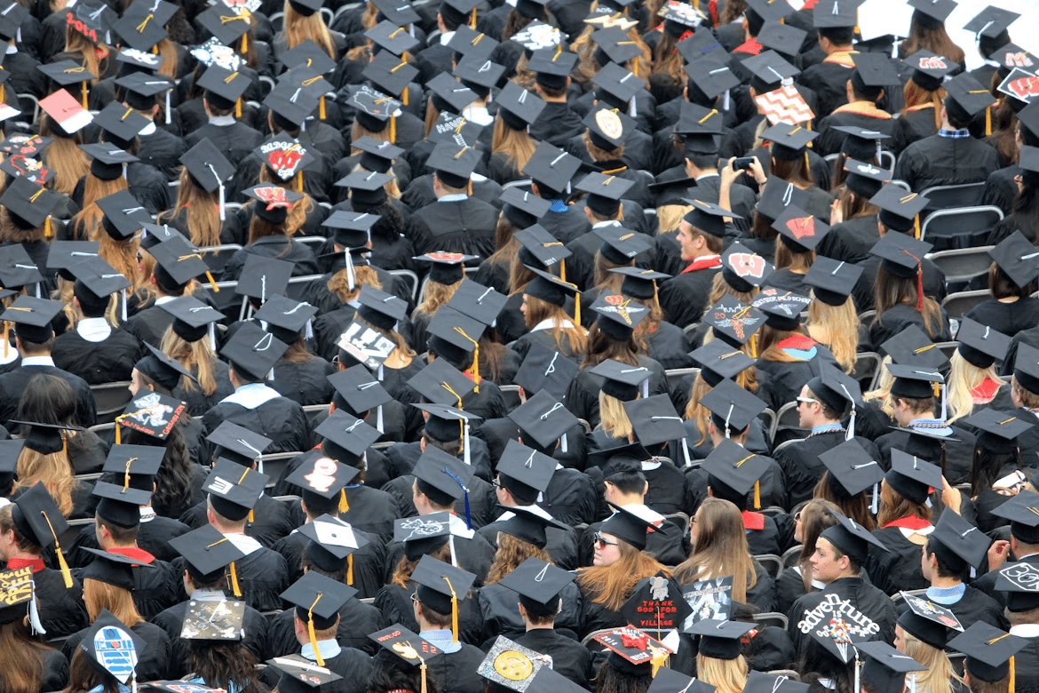 A crowd of students in graduation caps and gowns