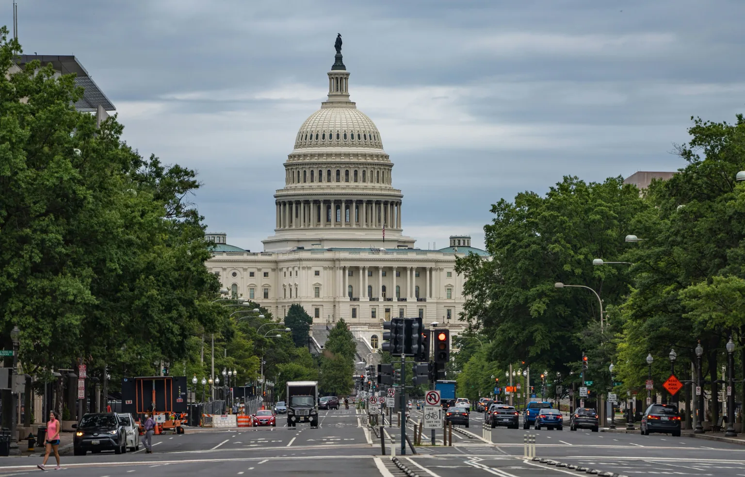 The U.S. Capitol at the end of a tree-lined avenue